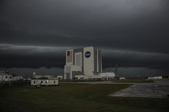 Storm clouds loom over the Vehicle Assembly Building at NASA&#039;s Kennedy Space Center in Florida.