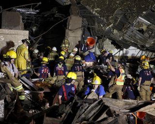 Oklahoma National Guard Soldiers and Airmen respond to a devastating tornado that ripped through Moore, Okla., May 20, 2013.