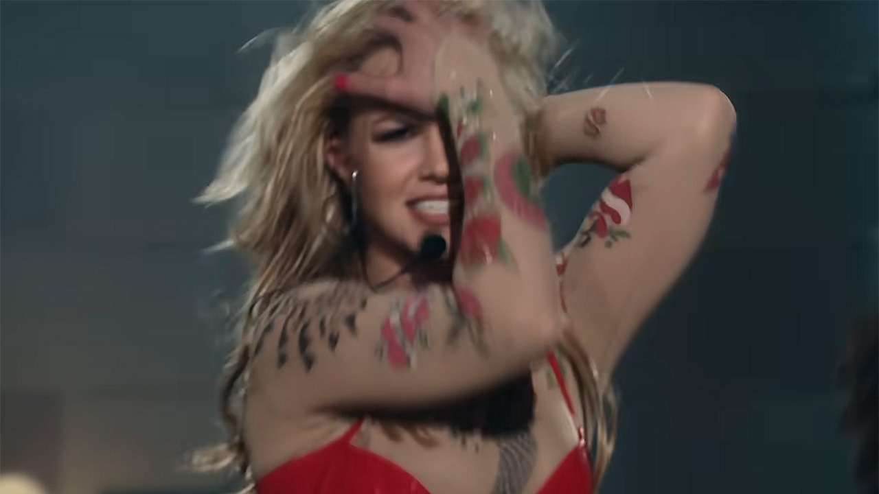 Still of Britney Spears dancing to &quot;Toxic&quot; in a sheer bodysuit with diamond rhinestones and fake tattoos.