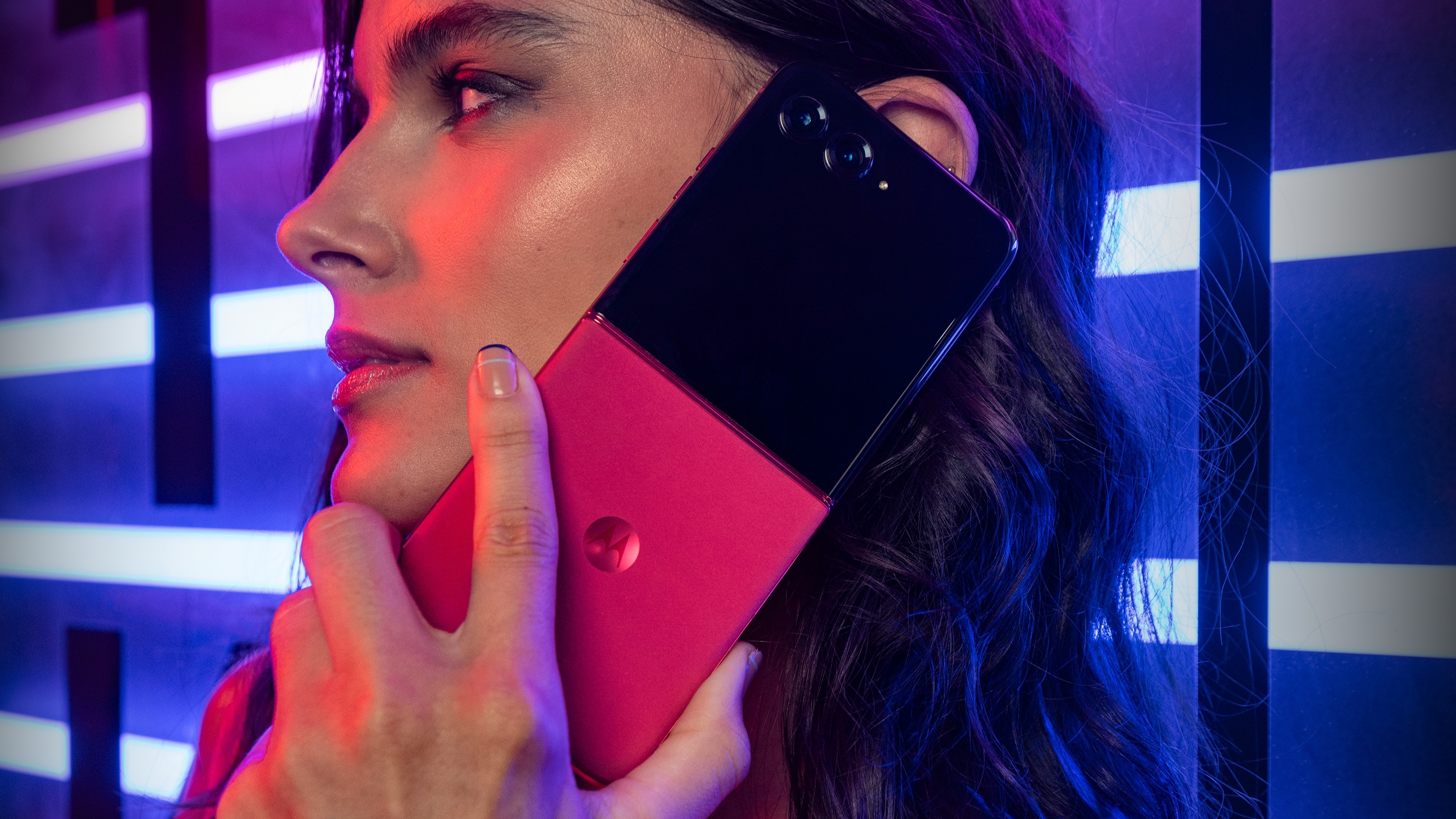 Razr Plus 2025 held up to a woman's face