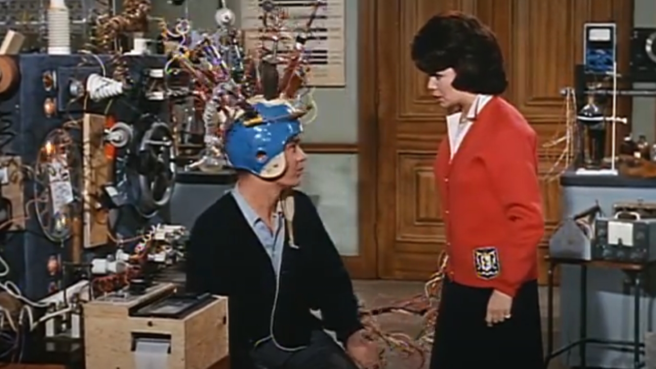 Tommy Kirk wearing science apparatus on his head while being yelled at by Annette Funichello