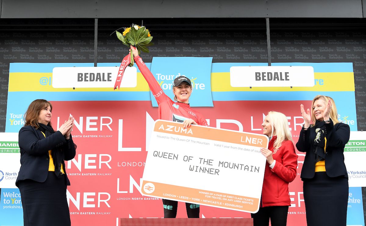 Elizabeth Banks of Team Bigla on the podium in the red jersey after winning queen of the mountain.
