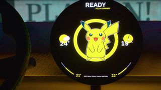A photo of a mini electric car's dashboard with Pokémon branding