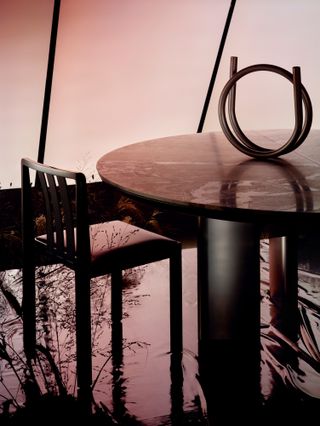 table, chair and tubular candlestick