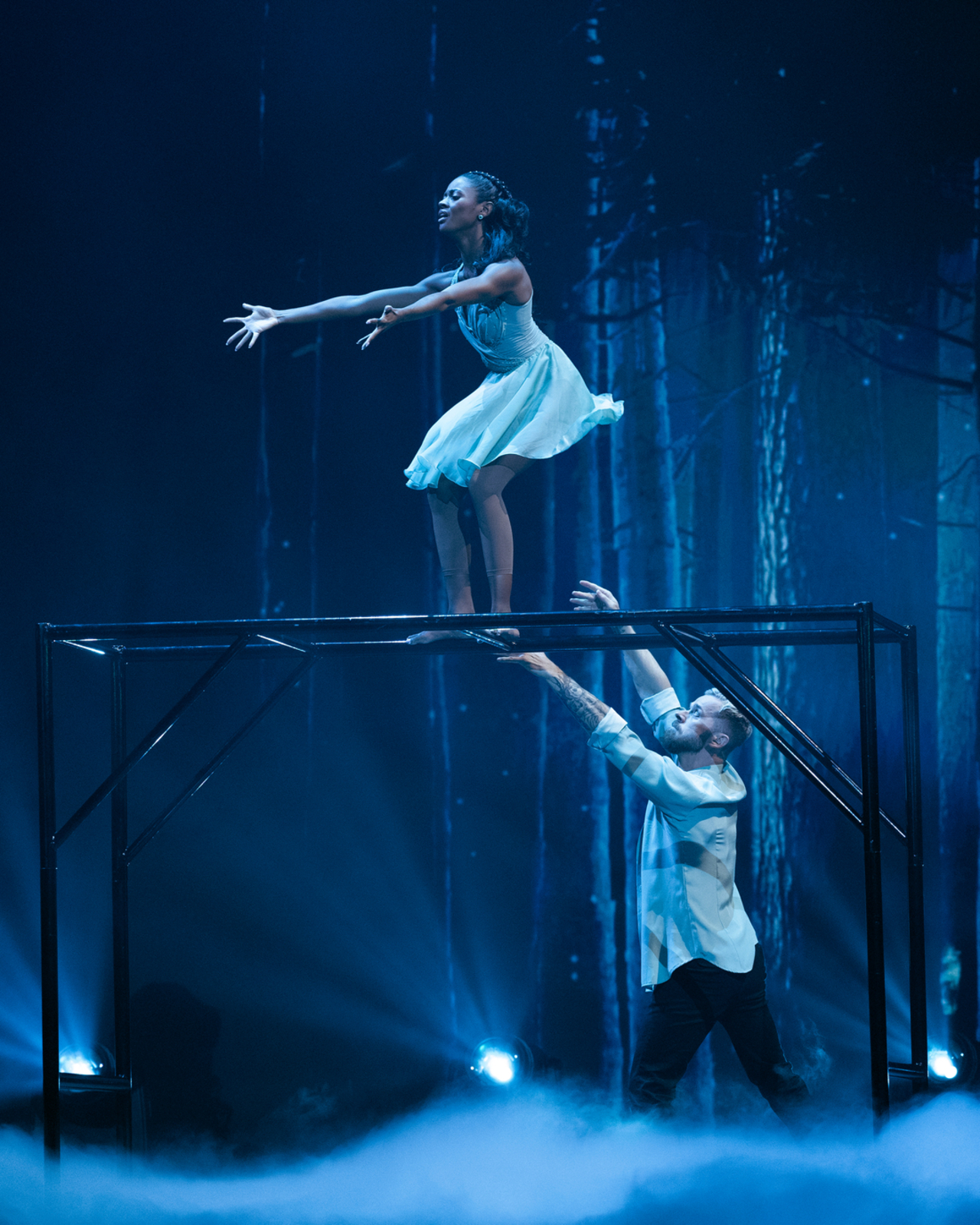 Charity Lawson getting ready to drop into Artem Chigvintsev's arms on Dancing with the Stars