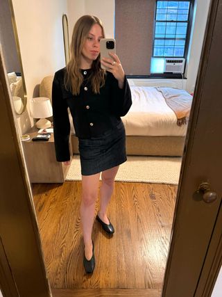 Nikki Chwatt wearing a Zara collarless jacket, mini skirt, and black ballet flats