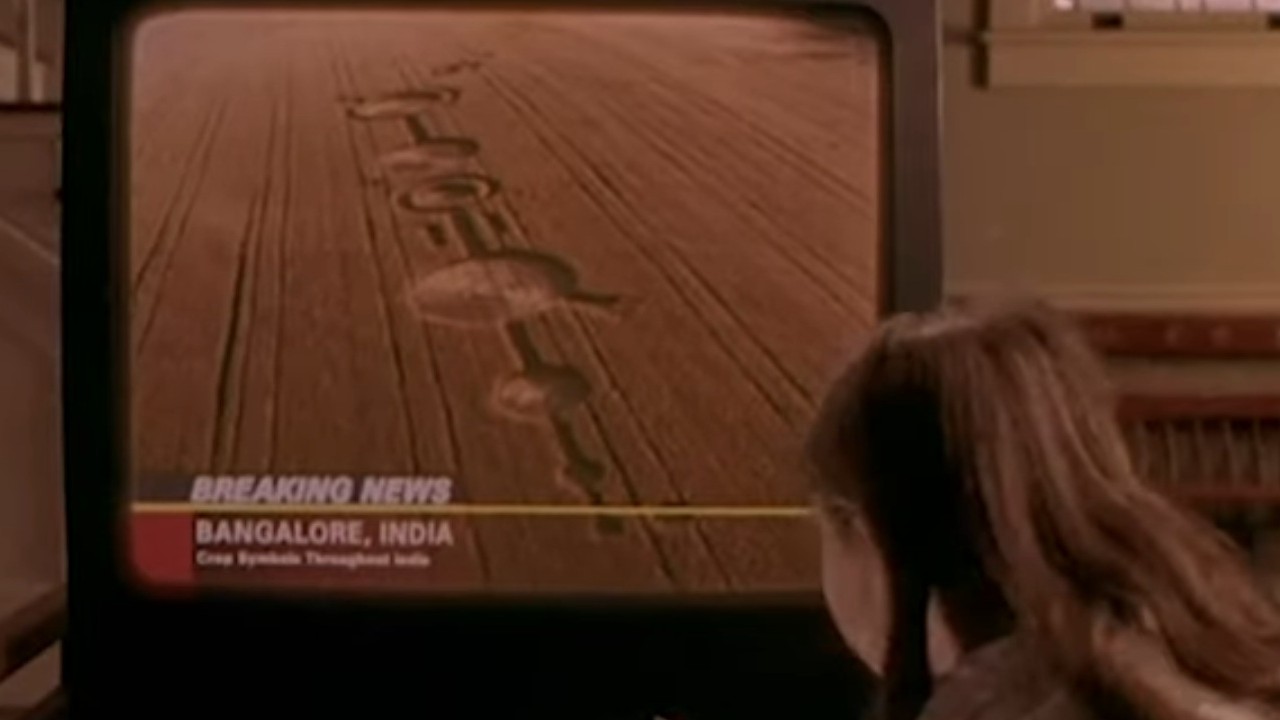 A child turrning on a TV with crop circles in Sigs