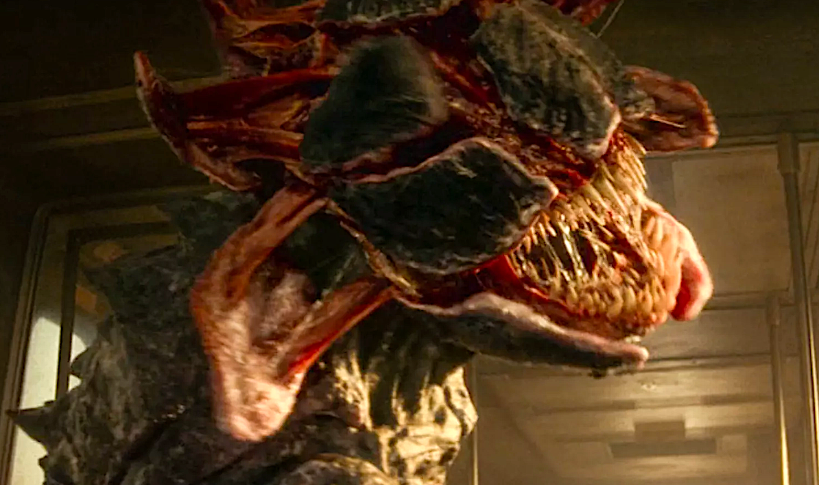 A ferocious armored alien creature opens its jaws
