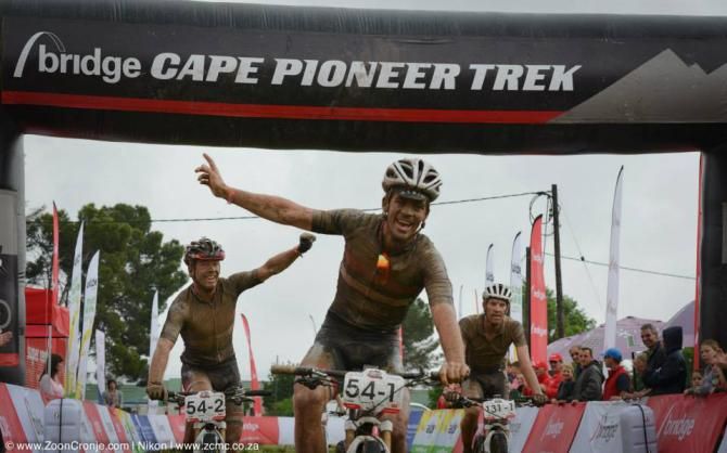 Asrin Cycling's James Reid (front) and Jens Schuermans celebrate after winning the sprint on Stage 6