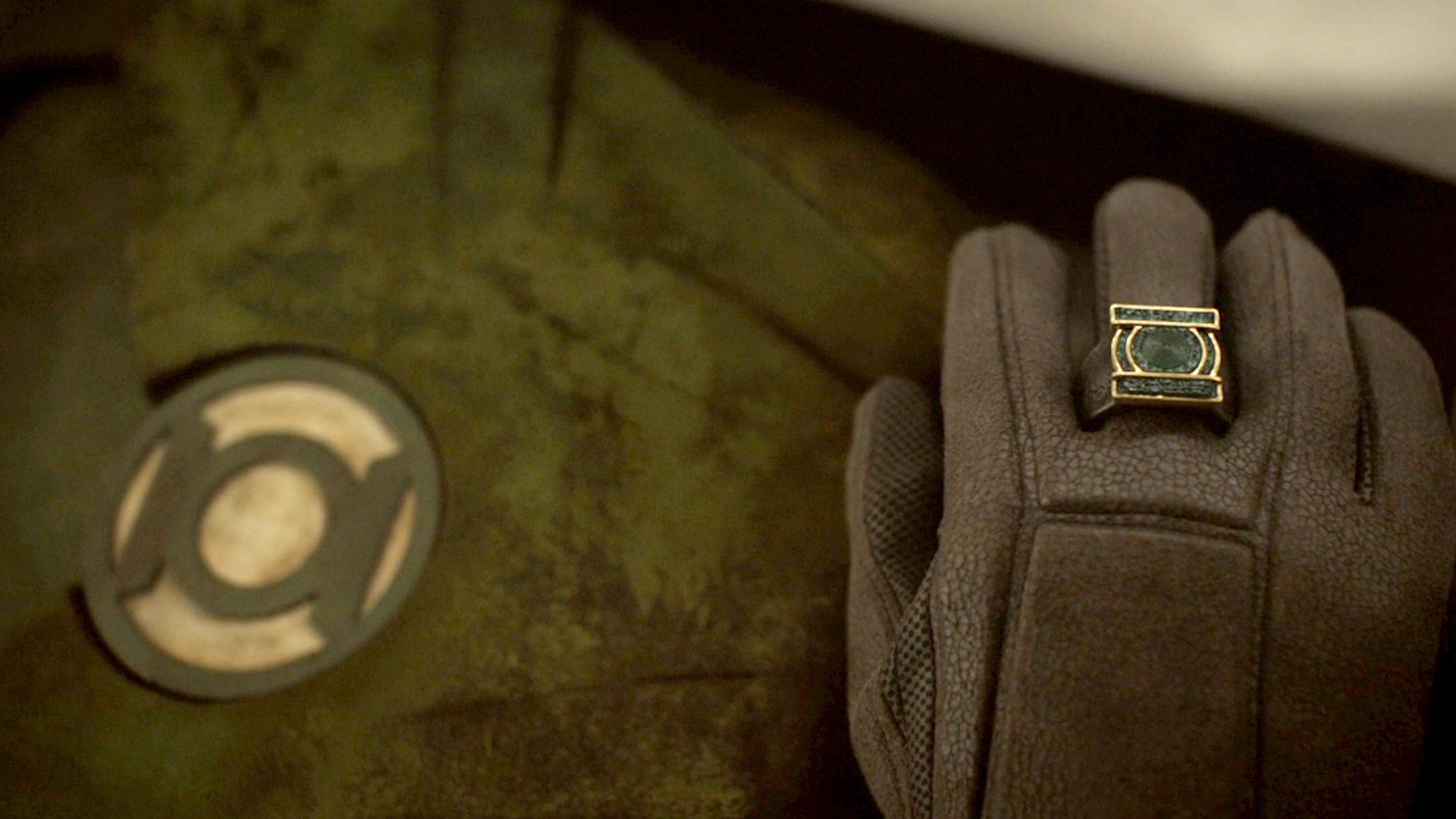 A close up of Hals suit and ring inside his casket in the sixth episode of Lanterns (2026).