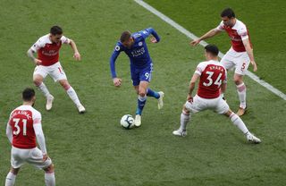 Jamie Vardy takes on the Arsenal defence