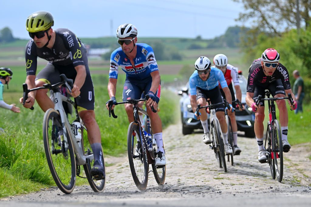 PONTMARCQ FRANCE MAY 17 LR Warre Vangheluwe of Belgium and Team Soudal QuickStep and Samuel Leroux of France and Team Van Rysel Roubaix compete in the breakaway passing through a cobblestones sector during the 68th 4 Jours de Dunkerque Grand Prix des Hauts de France 2024 Stage 4 a 1668km stage from Mazingarbe to PontMarcq on May 17 2024 in PontMarcq France Photo by Luc ClaessenGetty Images