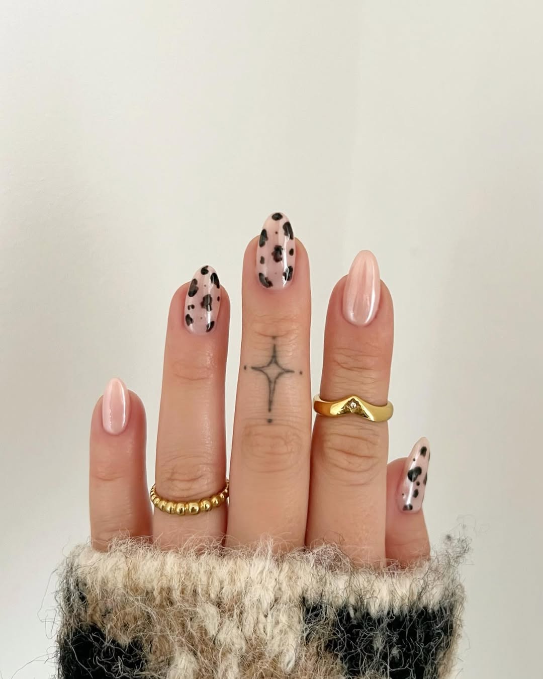 leopard nails with glazed donut nail accents