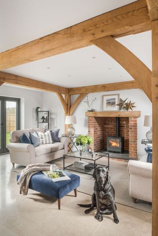living room with open fire and exposed oak frame
