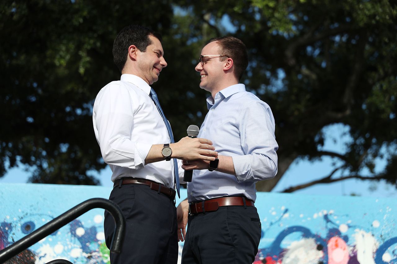 Presidential candidate Pete Buttigeig, left, with his husband, right.