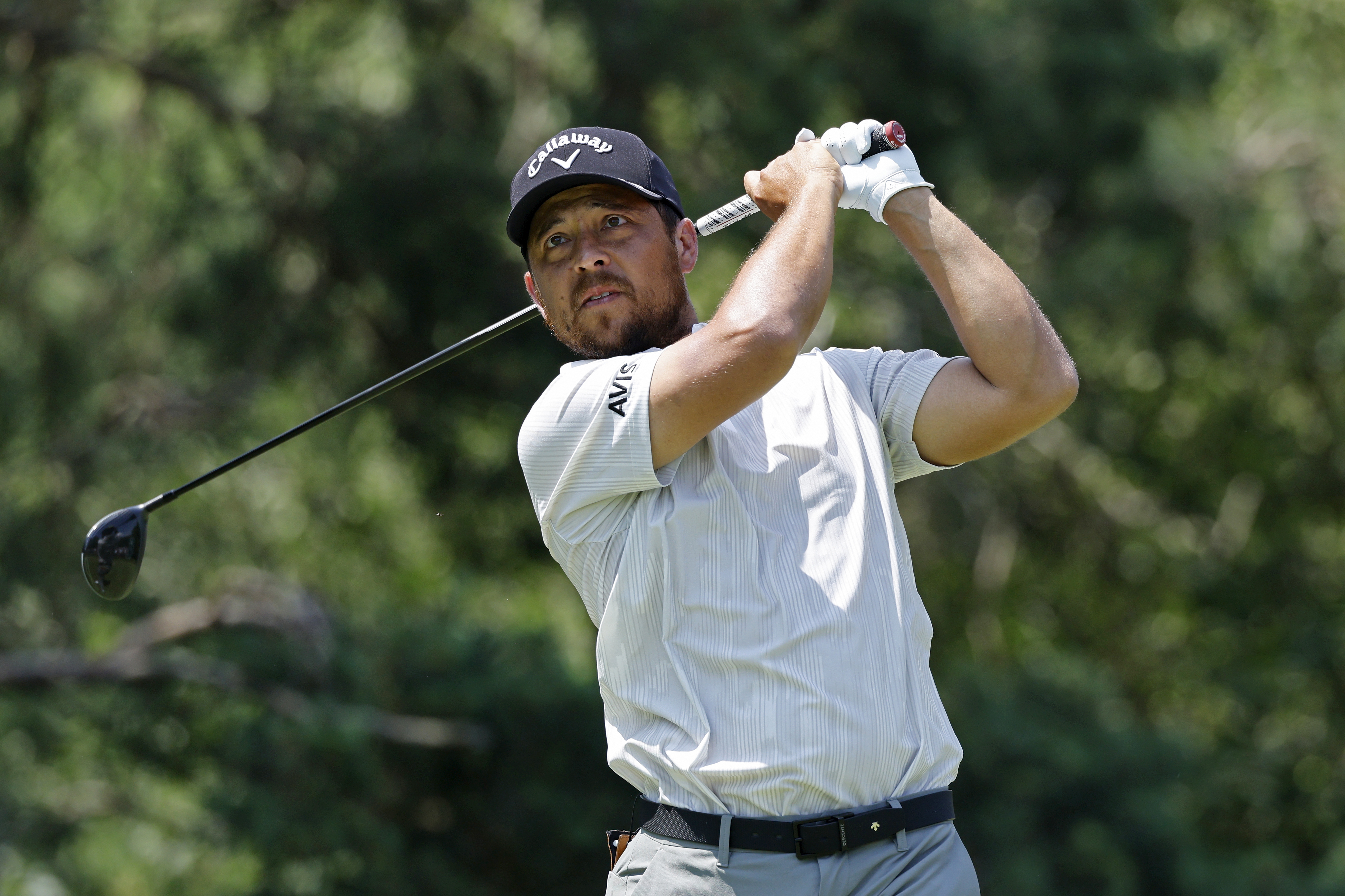 Xander Schauffele in the finish position with a fairway wood