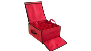 An opened red ornament storage box with two removable trays stacked on top of each other with individual compartments, for the best ornament storage containers.