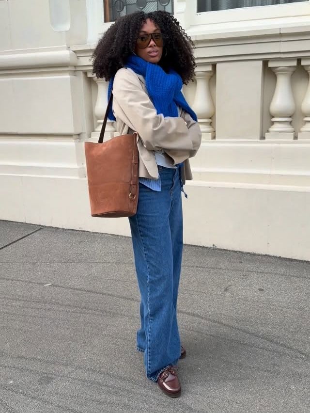 Claire in blue knit and jeans