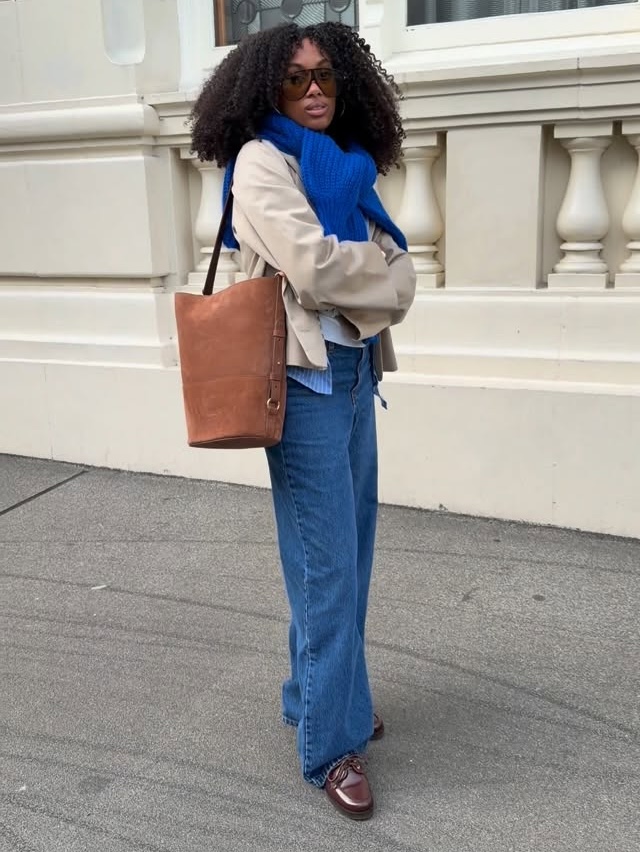 Claire in blue knit and jeans