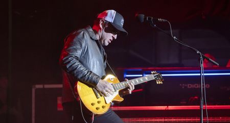 Joe Bonamassa performs with Black Country Communion at a 2025 show in Berlin. He plays a vintage Gibson Les Paul and wears a ballcap.