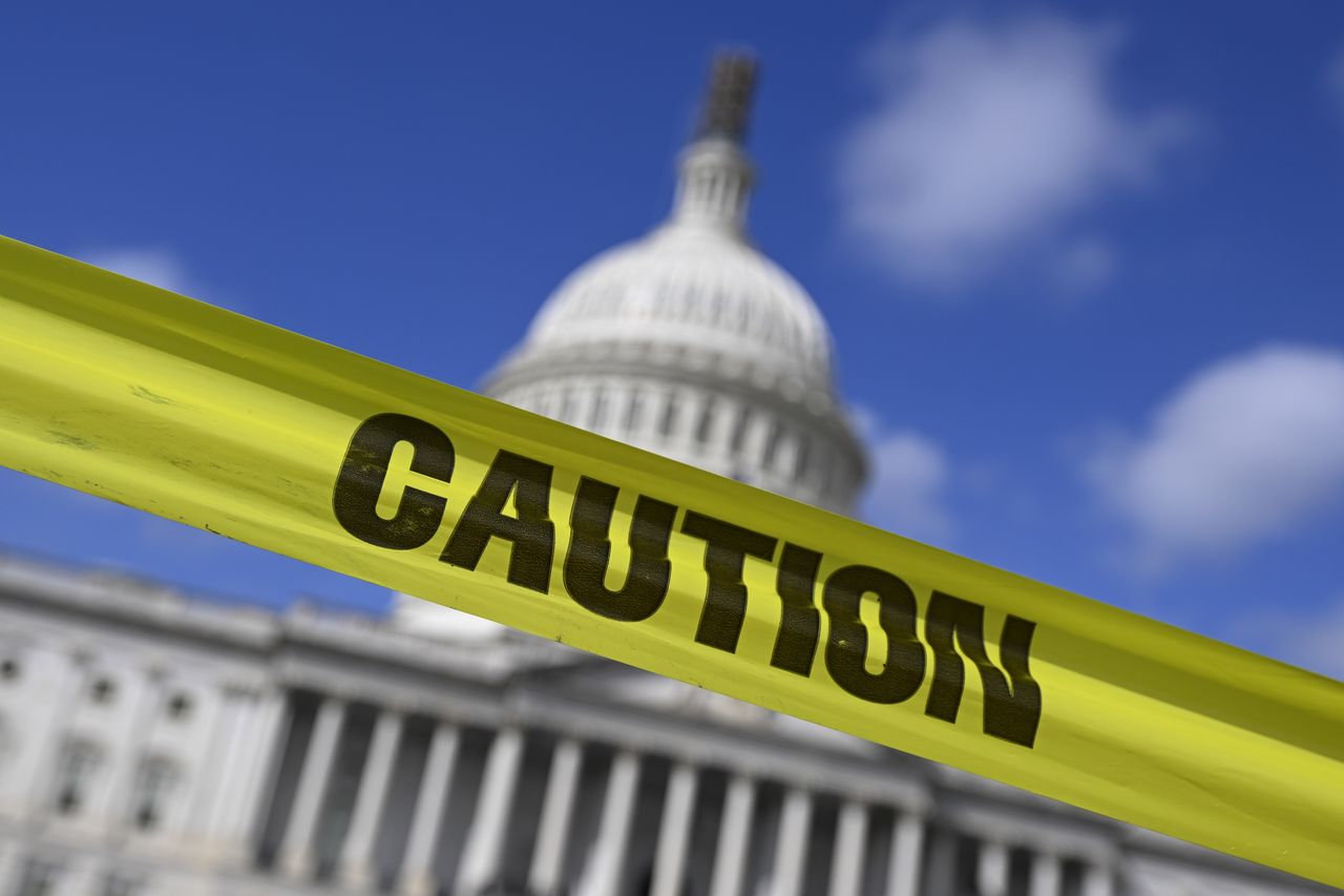 &quot;Caution&quot; tape across the United States Capitol building 