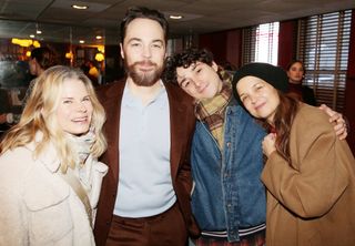 Celia Keenan-Bolger, Jim Parsons, Hagan Oliveras and Katie Holmes pose at a celebration honoring Jim Parsons for his performance in the play "Our Town" on Broadway with a caricature on the Sardi's wall of fame at Sardi's on January 7, 2025 in New York City.