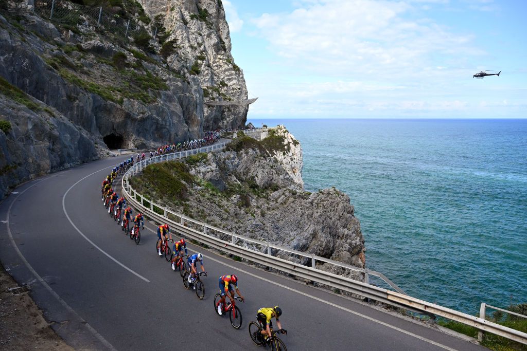 ANDORA ITALY MAY 07 LR Pieter Serry of Belgium and Team Soudal QuickStep Amanuel Ghebreigzabhier of Eritrea and Team Lidl Trek Jan Tratnik of Slovenia and Team Visma Lease a Bike and a general view of the peloton competing close to the Mediterranean seaside during the 107th Giro dItalia 2024 Stage 4 a 190km stage from Acqui Terme to Andora UCIWT on May 07 2024 in Andora Italy Photo by Tim de WaeleGetty Images