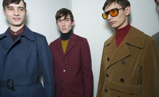 3 men in jackets at fashion show