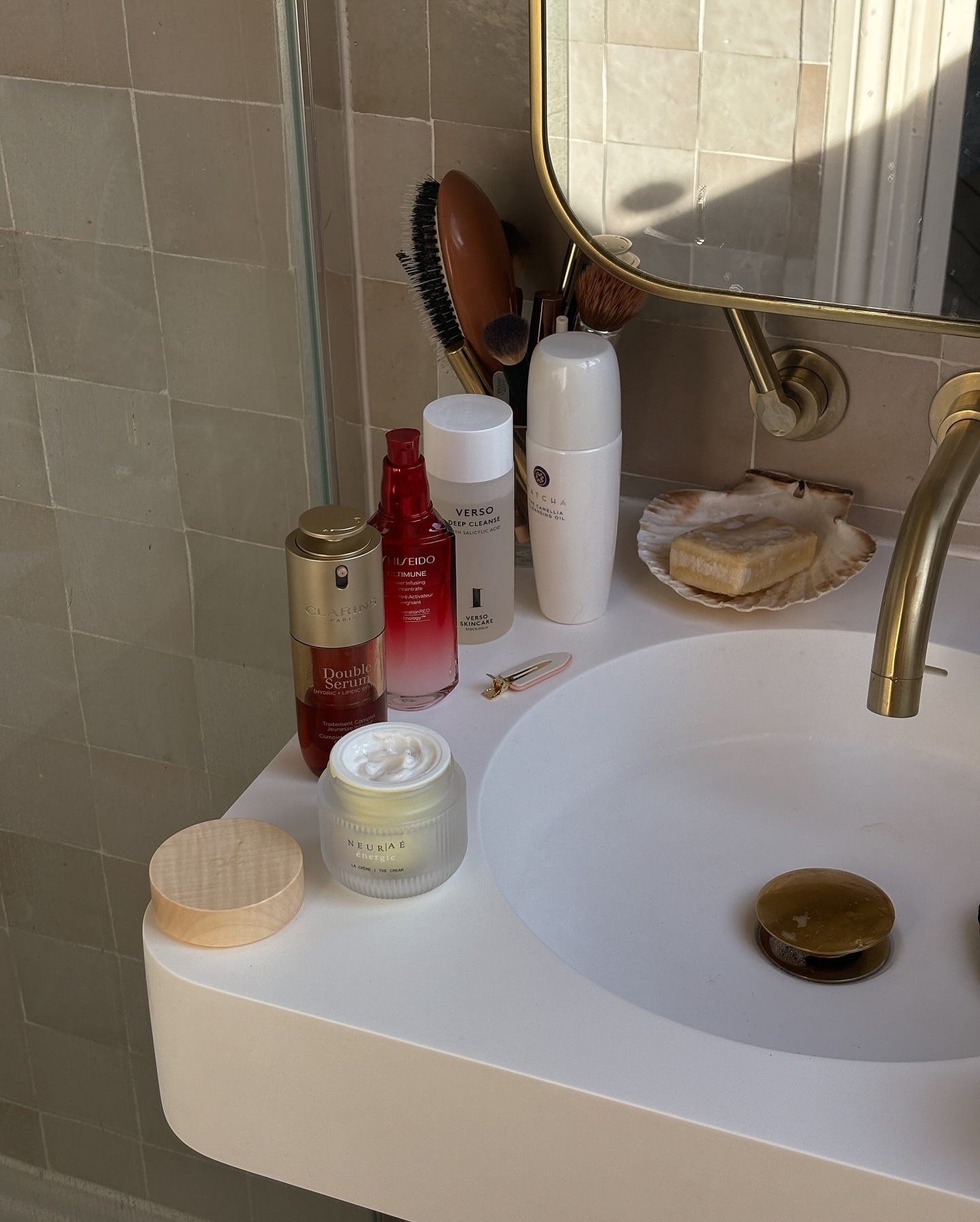 Beauty products on edge of sink