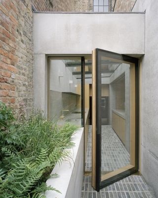 Pivot garden door at Islington House by McLaren Excell