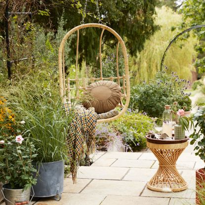 patio area with hanging egg chair