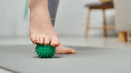 Woman using massage ball