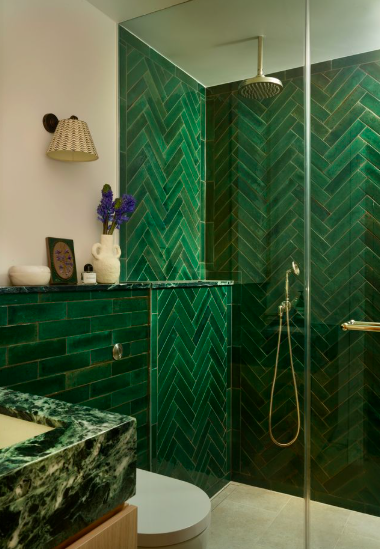 Emerald green zellige tiles with green marble sink