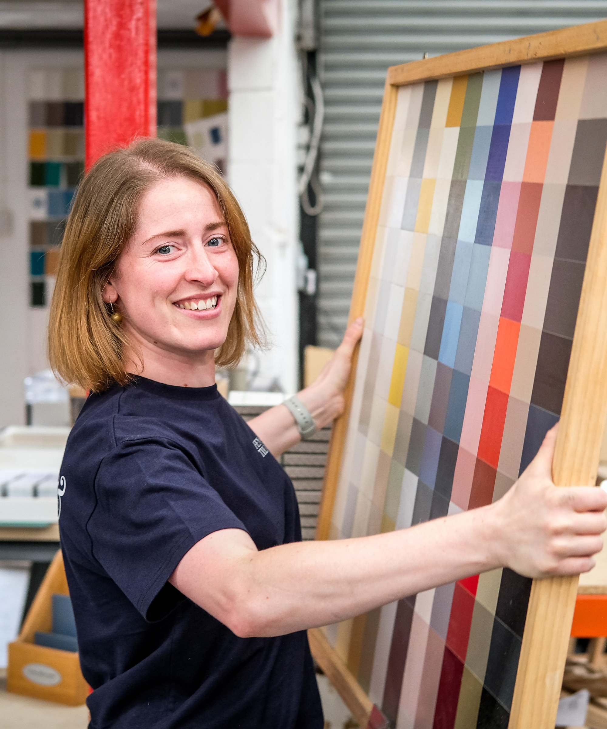 headshot of female looking at colour charts