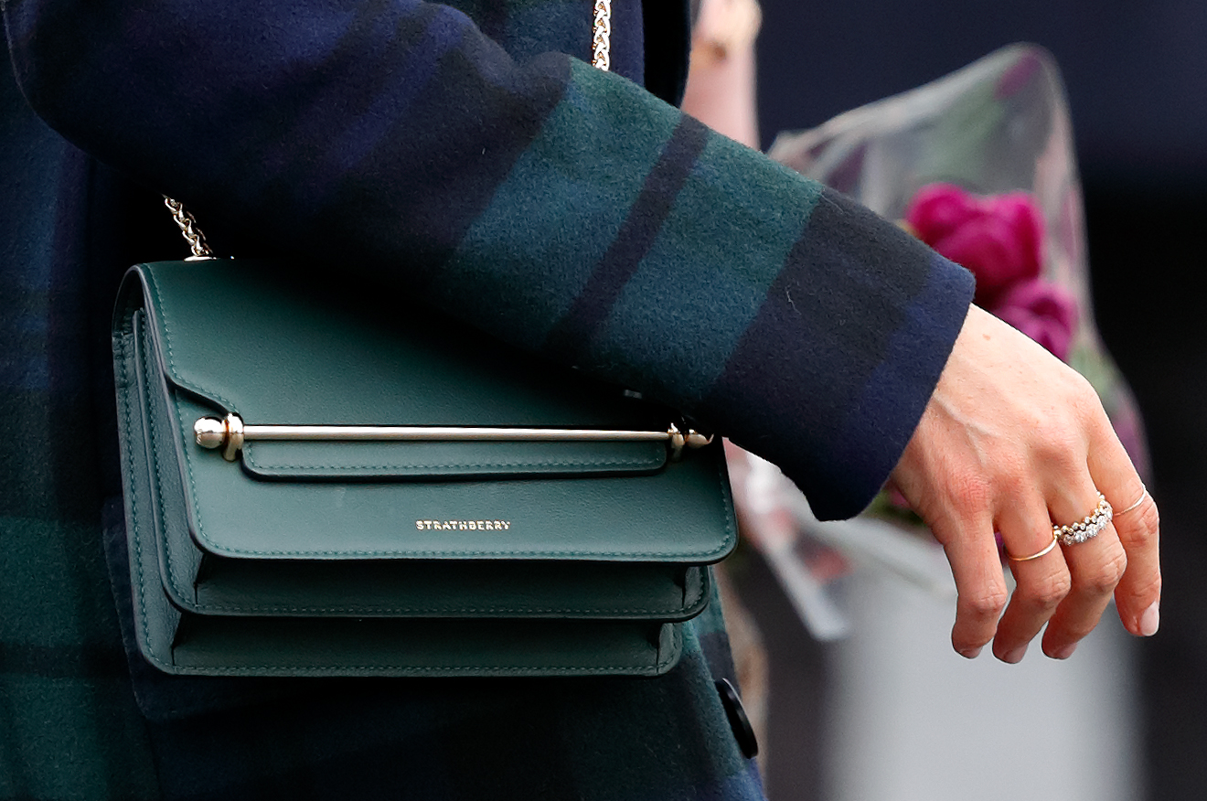 A close up of Meghan Markle's green Strathberry purse