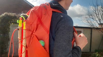 Fitness writer Lily Canter wearing the Patagonia Altvia Daypack hiking backpack outside