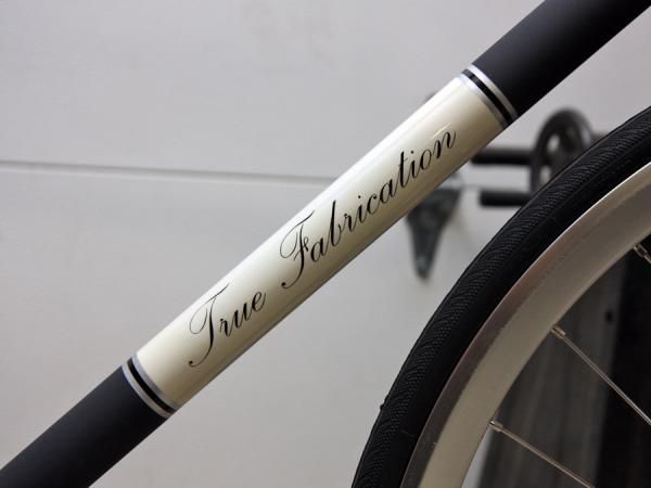 New for True Fabrication is this elegant script logo.
