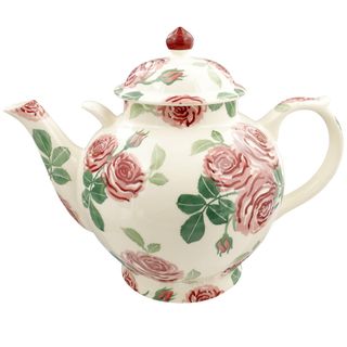 pink rose teapot with white background