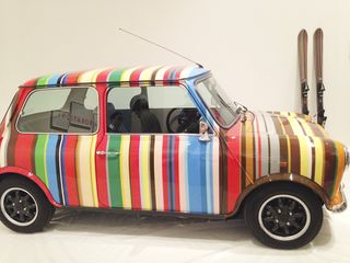 A striped Mini car and skis