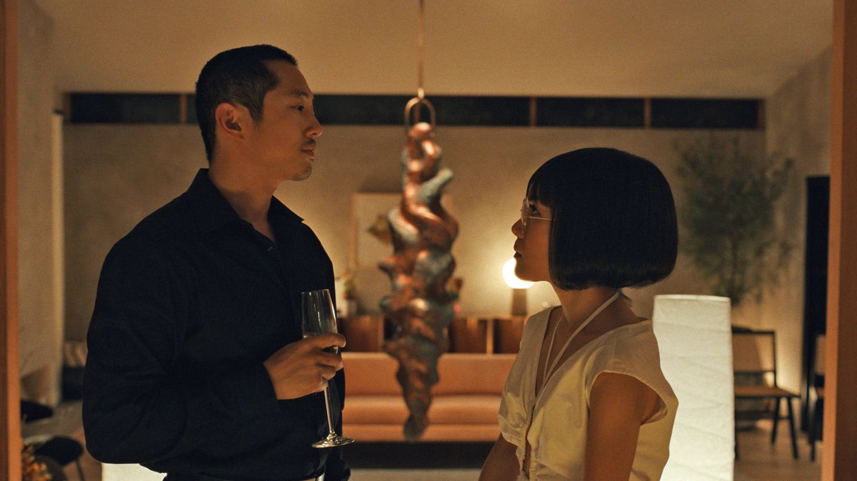 A still from the Netflix series Beef of Steven Yeun and Ali Wong