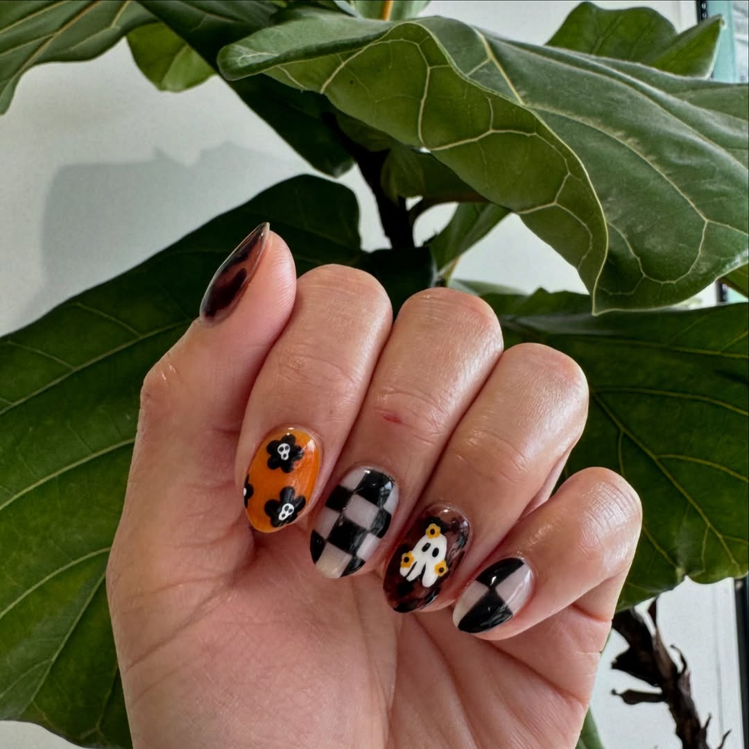 halloween nail art with checkerboard black and white nails