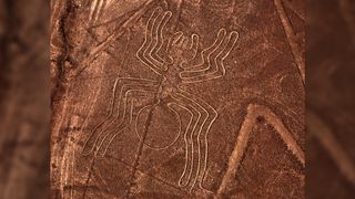 Aerial photo of Nazca lines in Peru. This geoglyph looks like a line drawing of a spider.