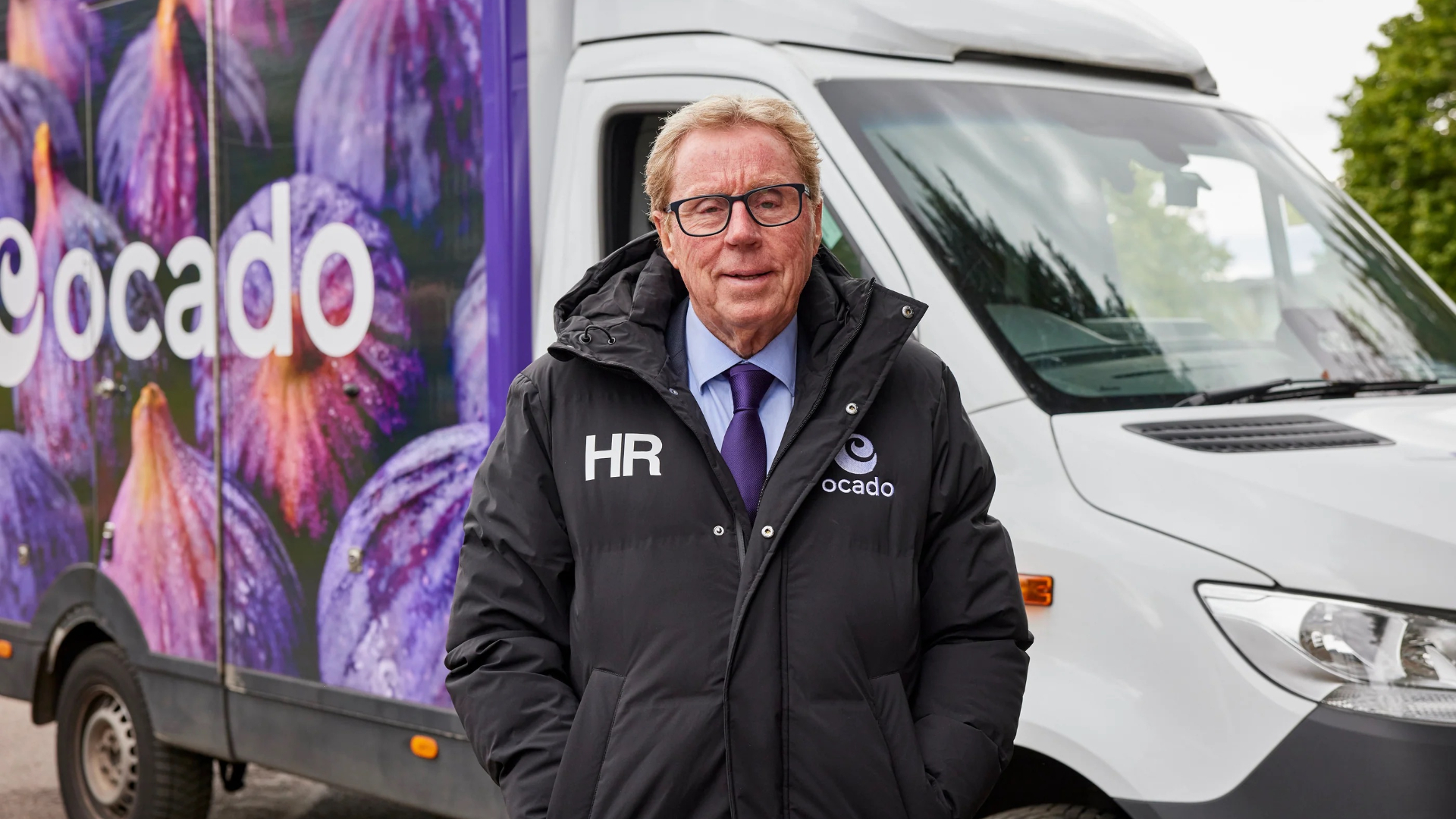Harry Redknapp in front of an Ocado lorry 