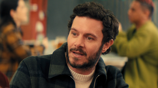 Adam Brody smiling in Nobody Wants This Season 2