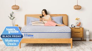 The Sealy Posturepedic mattress with a woman lying on top of it on her phone