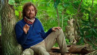 Christian talks to the camera on Survivor about planting a fake idol.