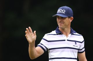 Billy Horschel waves to the crowd on the 18th green