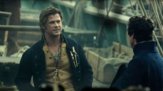 Chris Hemsworth talks with Benjamin Walker on the ship's deck in In The Heart Of The Sea.