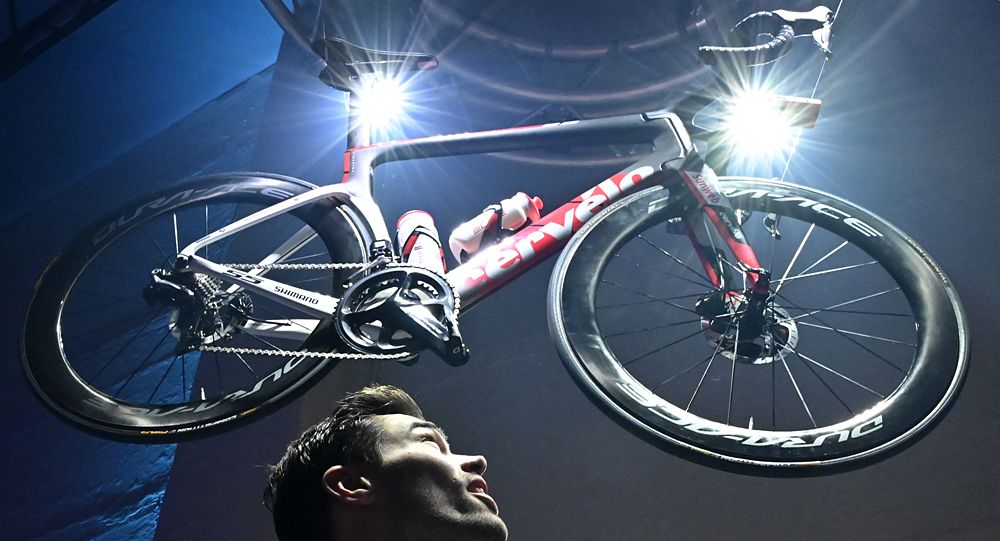 Tom Dumoulin poses with the new Cervelo for photographers during the 2019 Sunweb cycling team's official presentation