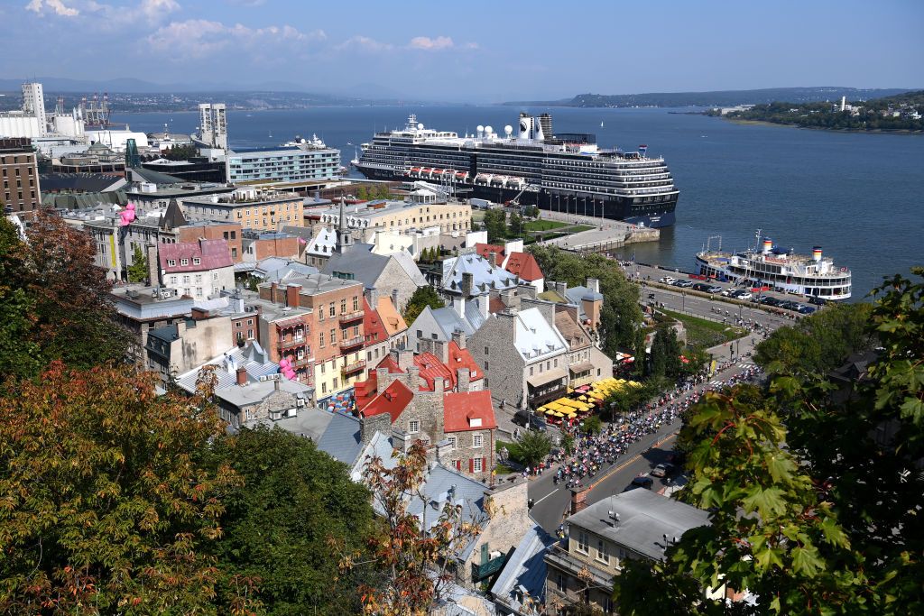QUEBEC CITY QUEBEC SEPTEMBER 13 A general view of the peloton passing the city harbor during the 13th Grand Prix Cycliste de Quebec 2024 a 2016km one day race from Quebec City to Quebec City UCIWT on September 13 2024 in Quebec City Quebec Photo by Alex BroadwayGetty Images